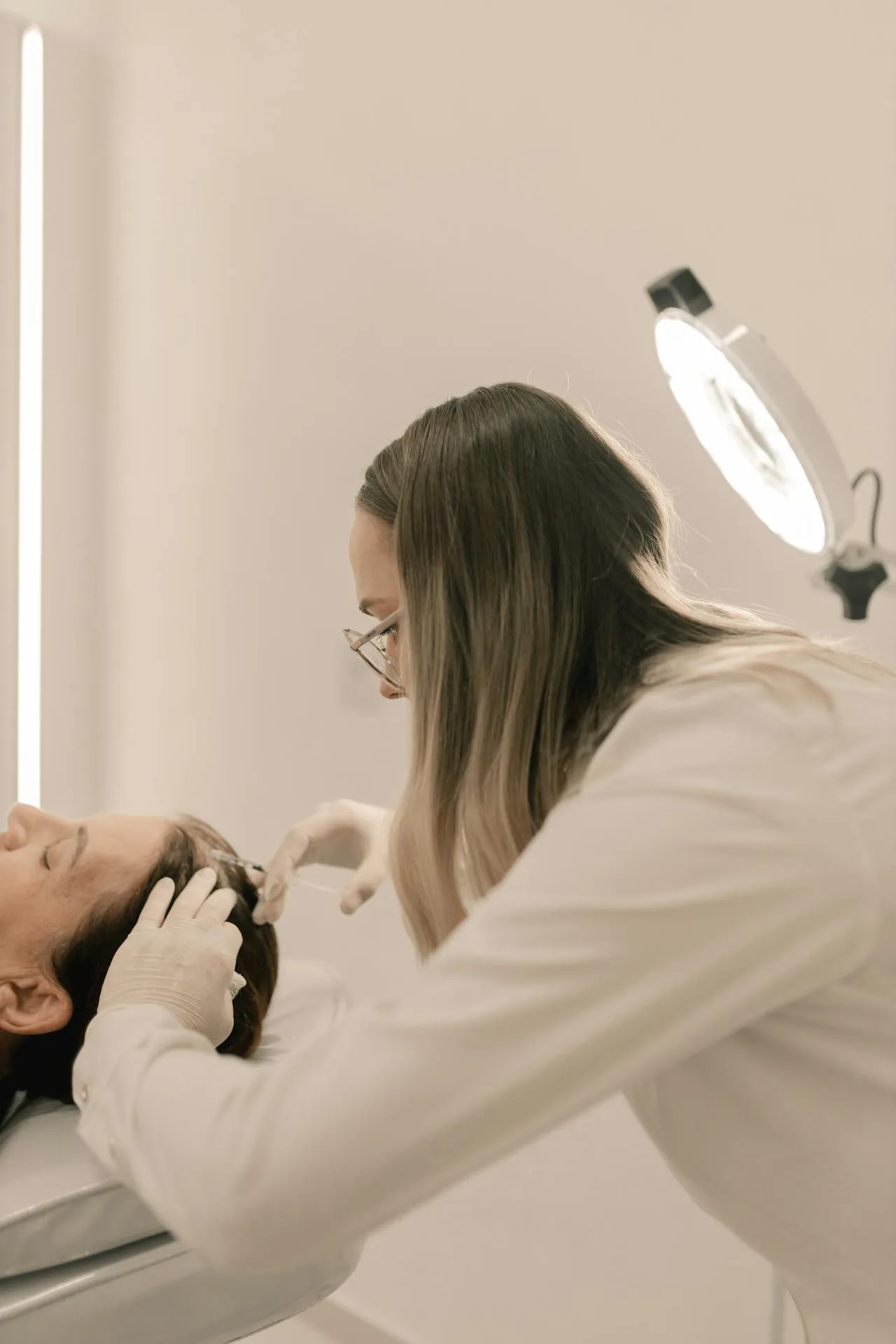 Board-certified dermatologist performing skin examination